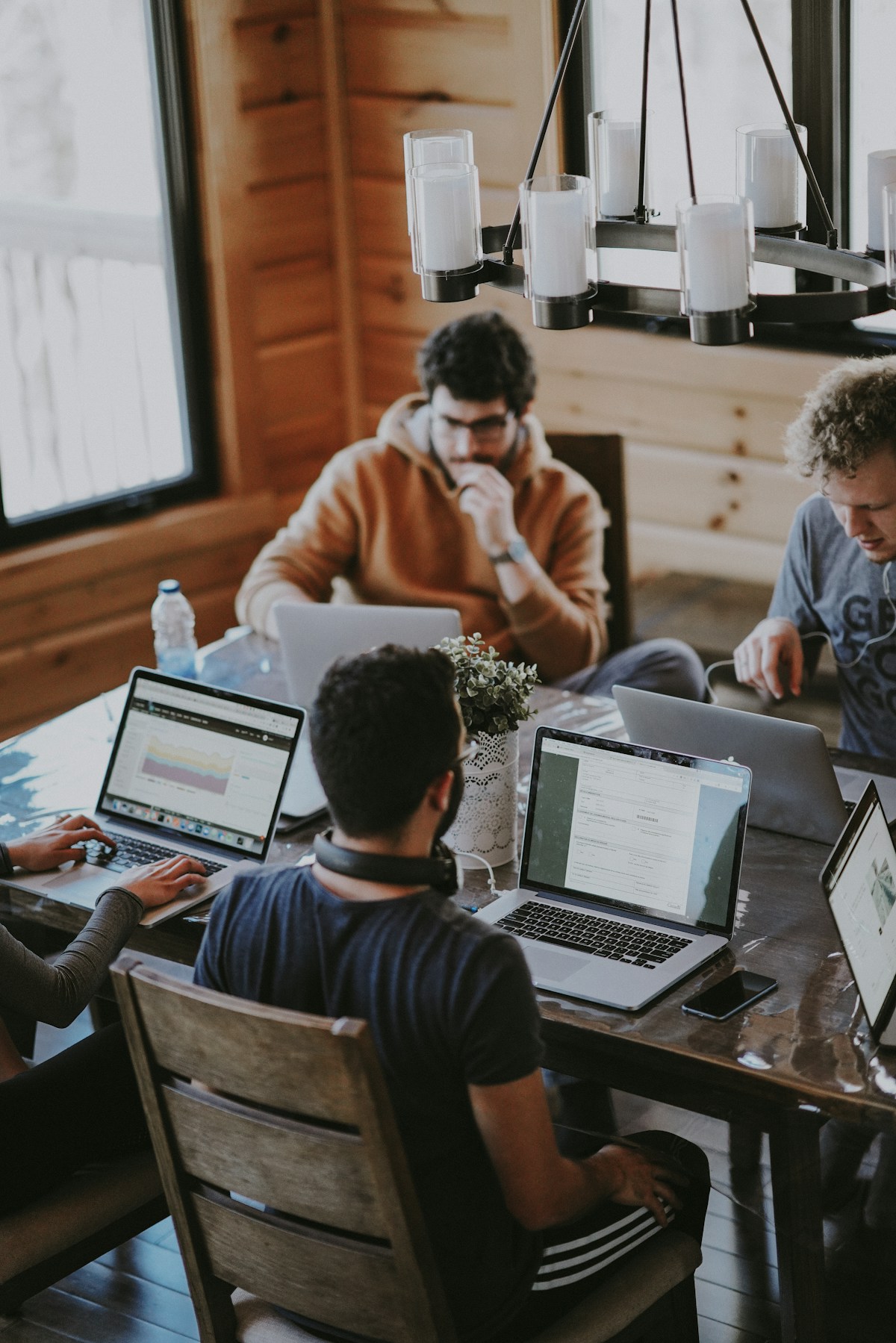 Illustrative photograph of a small team working together around a table